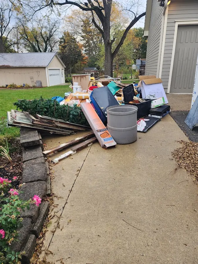 Dumpster being loaded with debris for 3 Yard Dumpster Rental in Barboursville